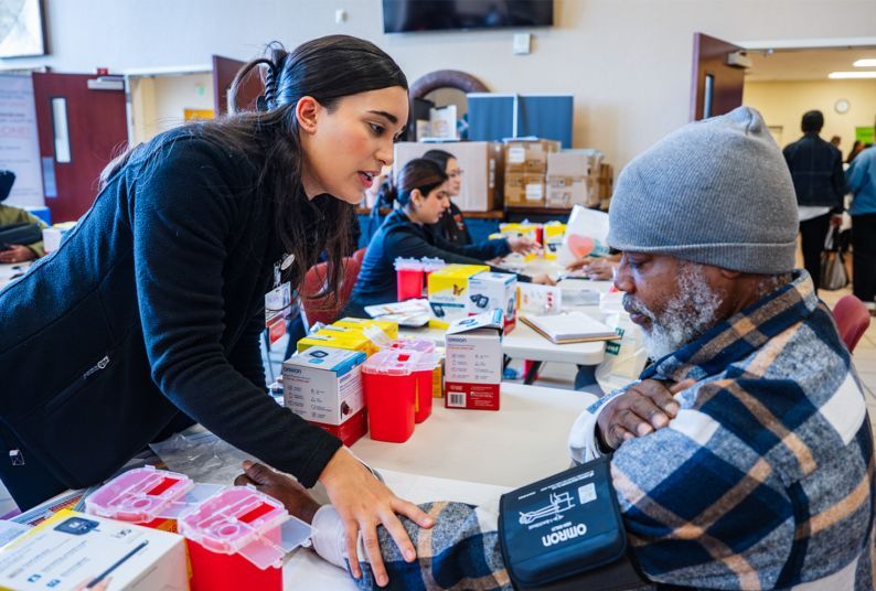a student interacts with a patient